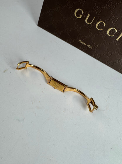 Montre Gucci vintage à mors en or