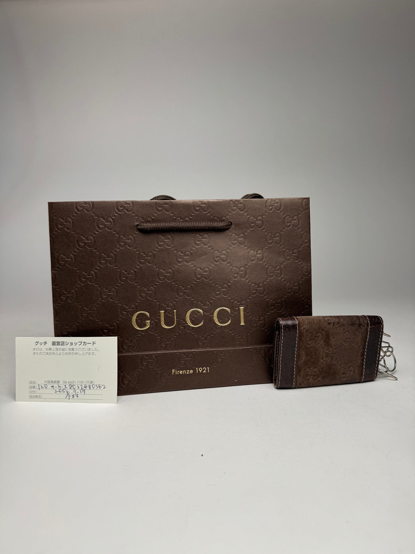 Porte-clés vintage Gucci en cuir suédé et monogramme marron