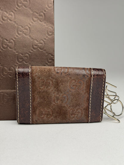 Porte-clés vintage Gucci en cuir suédé et monogramme marron