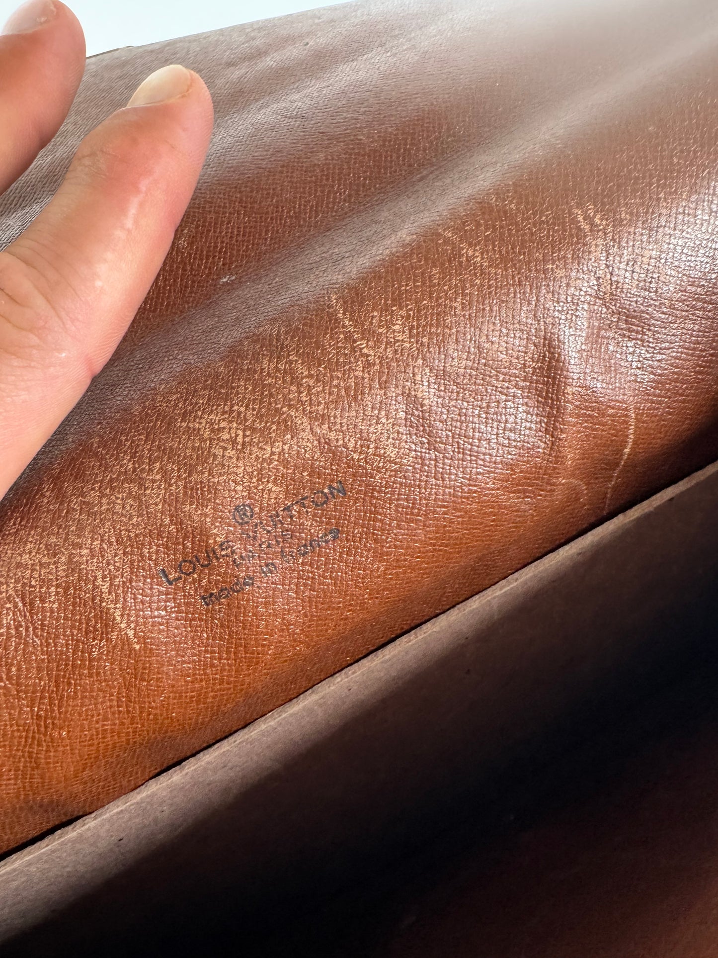 Vintage Louis Vuitton monogram leather clutch