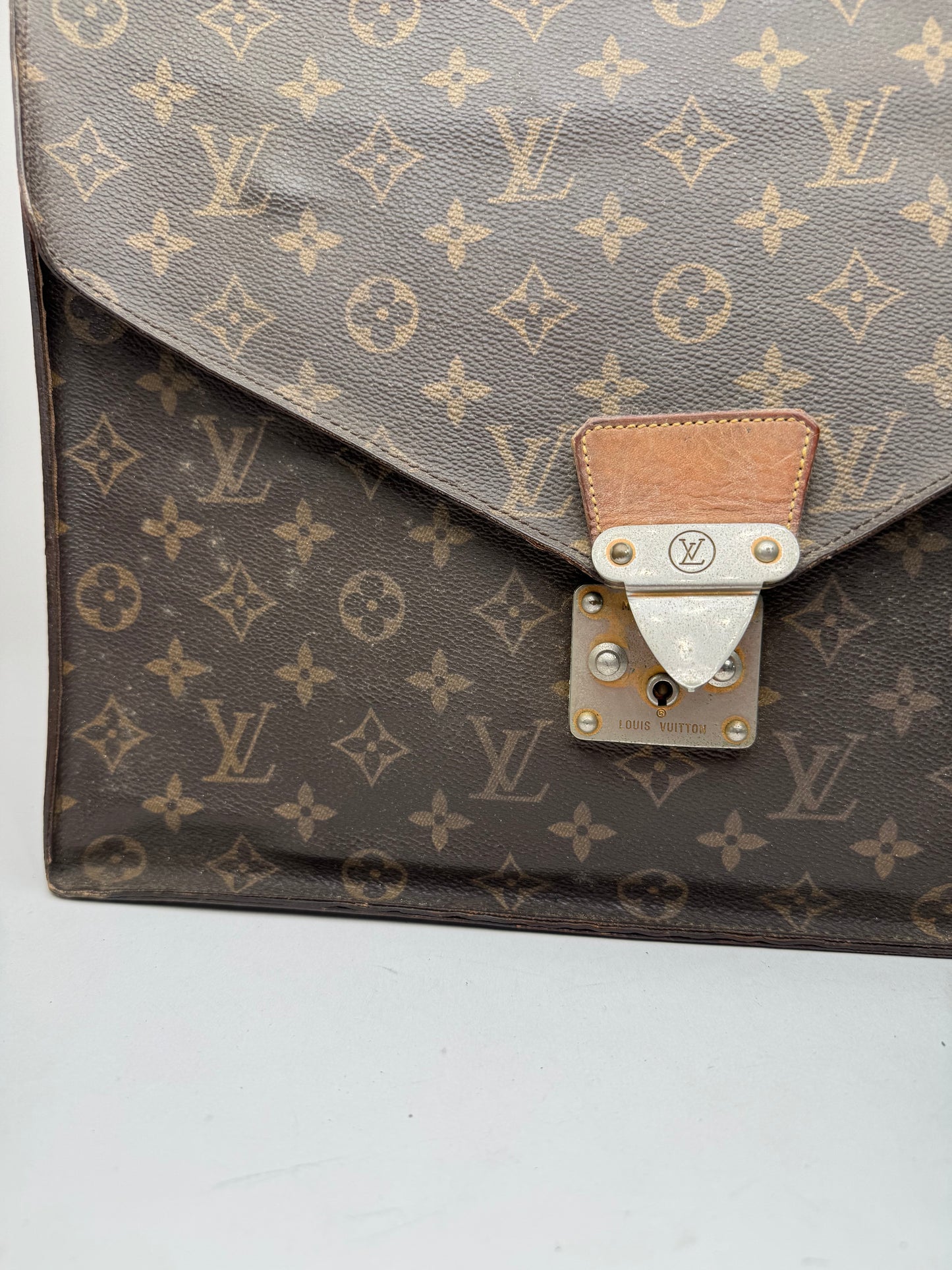 Vintage Louis Vuitton monogram leather clutch