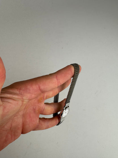 Montre à quartz vintage Courreges en métal argenté