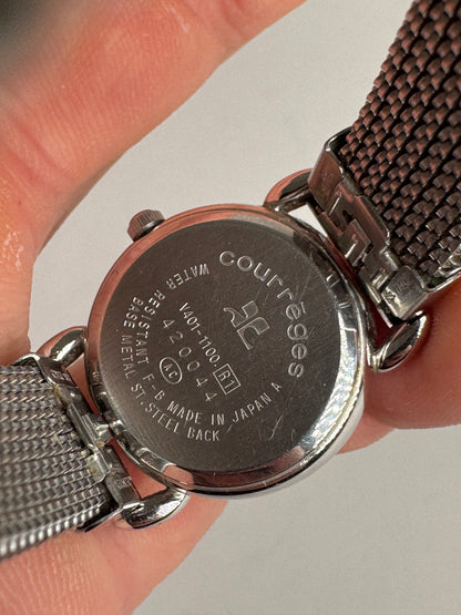 Montre à quartz vintage Courreges en métal argenté