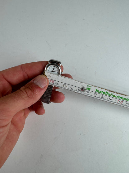 Montre à quartz vintage Courreges en métal argenté