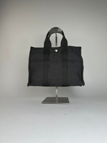Hermès Black Canvas Tote Bag with Zip Closure and Snap Button