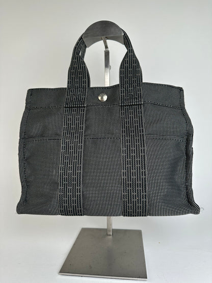 Hermès Black Canvas Tote Bag with Zip Closure and Snap Button