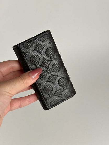 Porte-clés Coach vintage en cuir monogramme noir