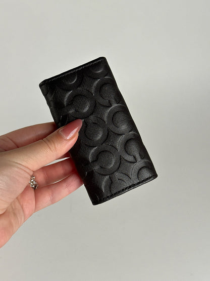 Porte-clés Coach vintage en cuir monogramme noir