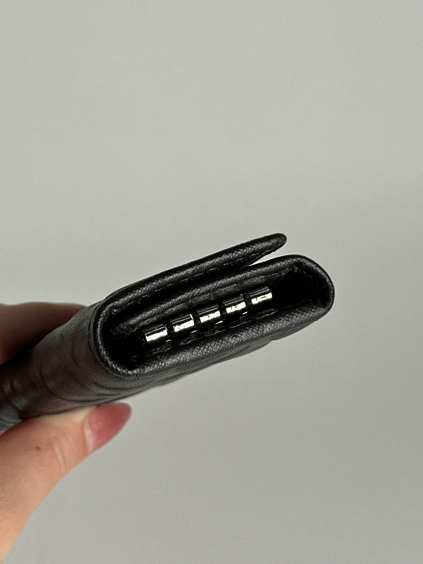 Porte-clés Coach vintage en cuir monogramme noir