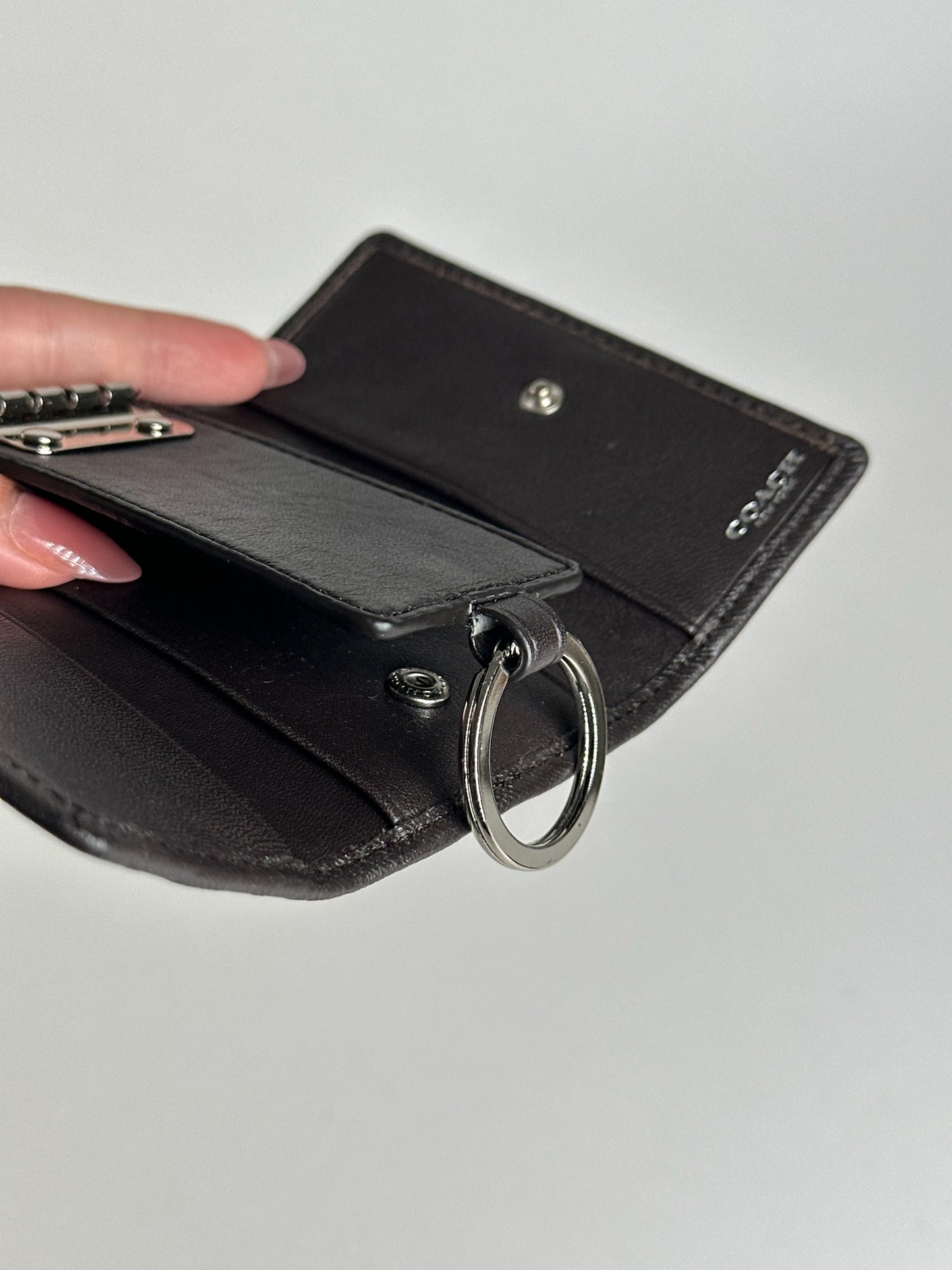 Porte-clés Coach vintage en cuir monogramme noir