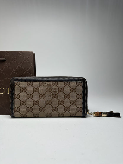 Portefeuille vintage en cuir monogramme Gucci beige marron