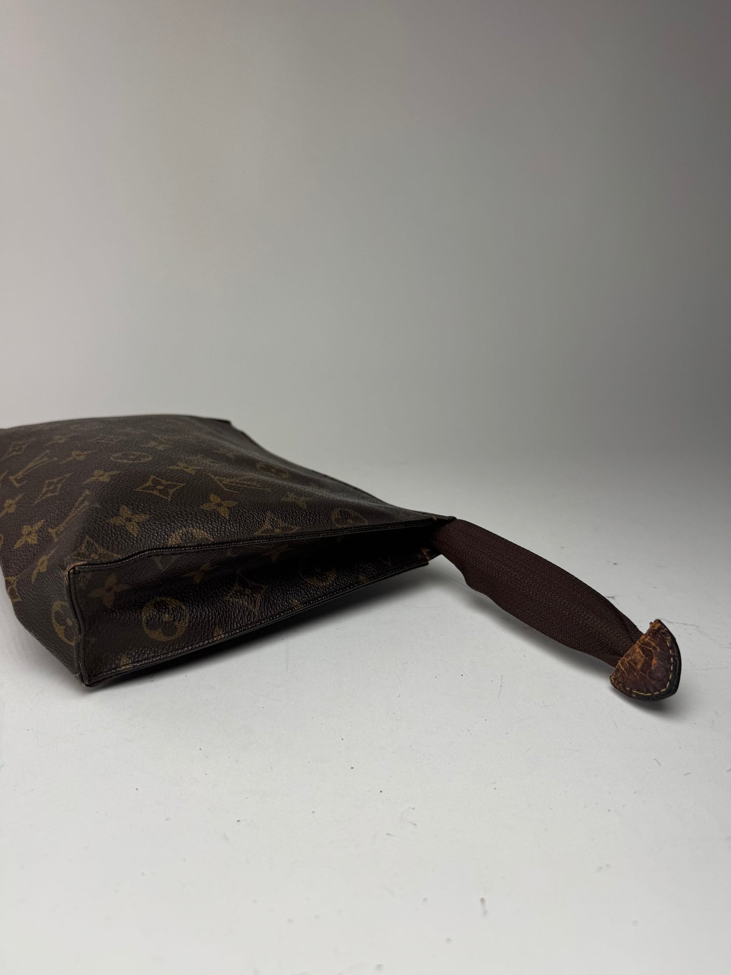 Vintage Louis Vuitton monogram leather clutch brown